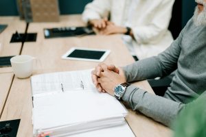 a man with his hands folded